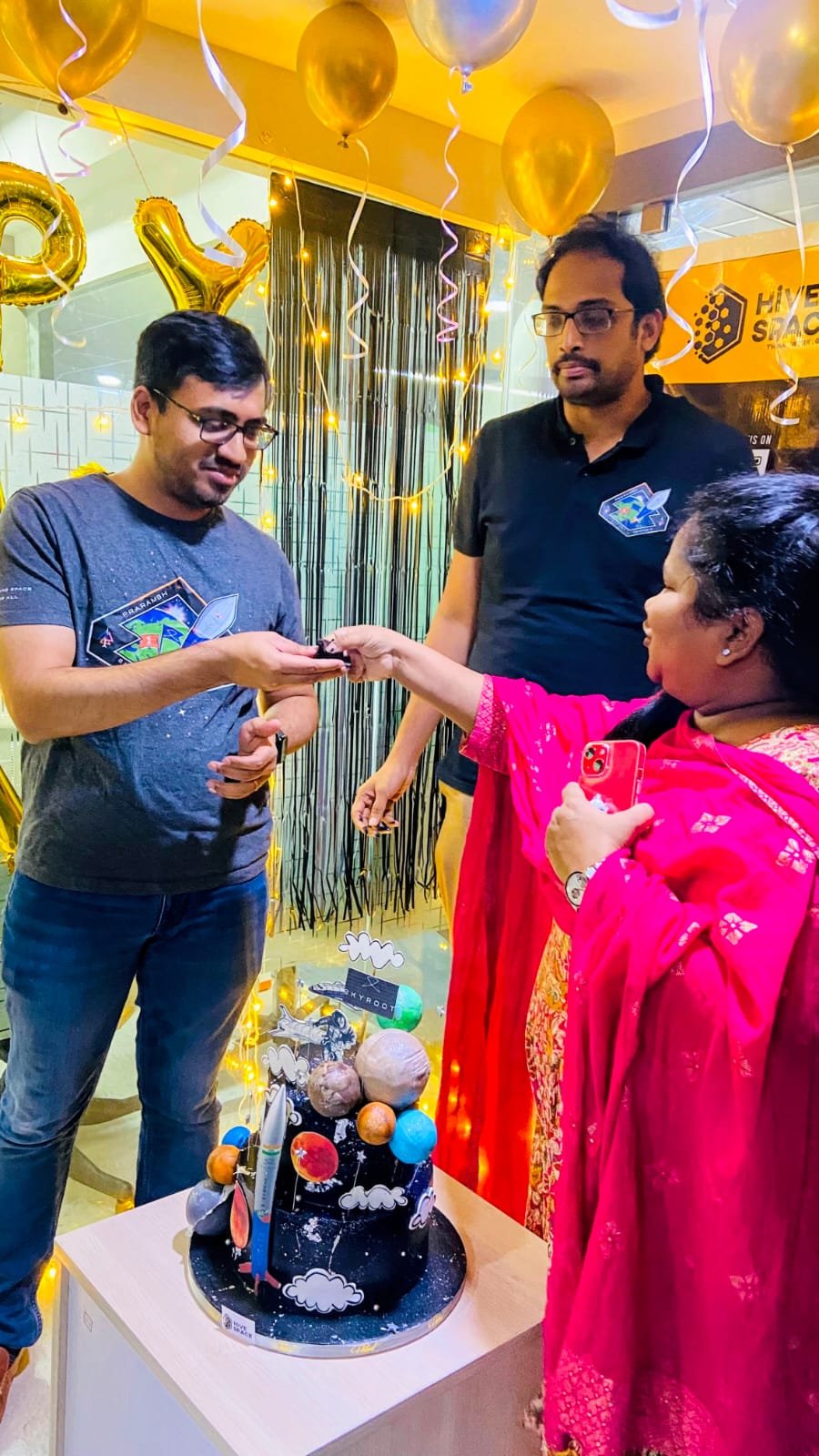 A Hive Space team member congratulating the Skyroot team